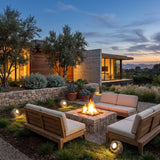 Rocky Light (Outdoor Solar) around an outdoor fire pit seating area at dusk