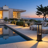 Nimbus Quad Solar Light lining a poolside terrace at dusk
