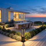 Nimbus Quad Solar Light lighting an outdoor dining terrace at dusk