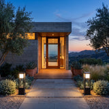 A matched pair of Nimbus Cube Solar Light lighting a front entrance at dusk