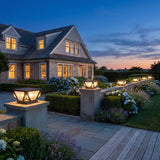 Glow Beam Outdoor Light (Solar) on masonry gate piers at dusk
