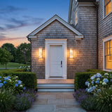 A matched pair of Marble Outdoor Wall Light flanking a front door at dusk
