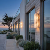 A run of Marble Outdoor Wall Light along a house facade at dusk