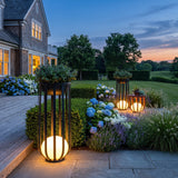 Flower Pot Lamp (Outdoor Solar) glowing on a luxury estate terrace at dusk