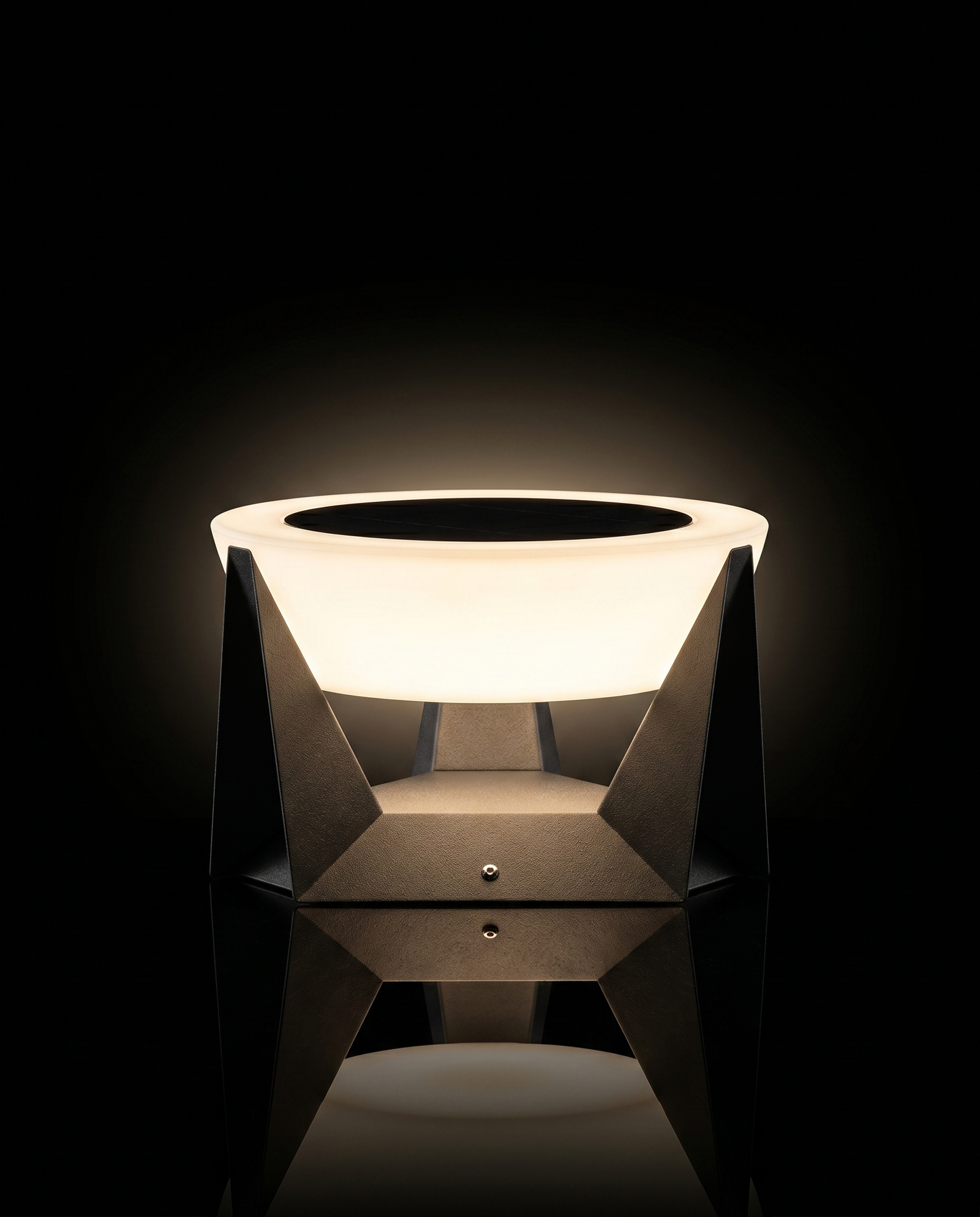 Lamp glowing on a dark terrace at night